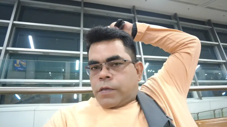 AJ Backpacker is taking a casual selfie at Indira Gandhi International Airport, New Delhi.